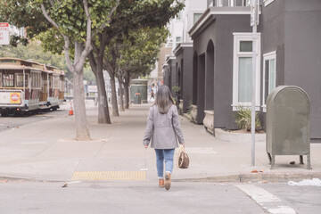 Fototapeta na wymiar person walking in the street