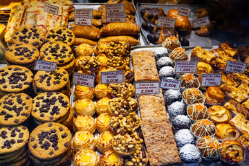 Confectionery shop window - cakes, pastries, desserts. Traditional Catalan pastry shop