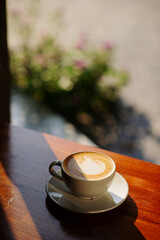hot latte art coffee on wood table, relax time