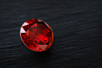 Ruby Gem Stone round cut on stone background