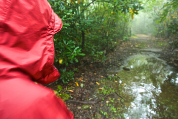 A woman hikes on a rainy day in North Carolina.