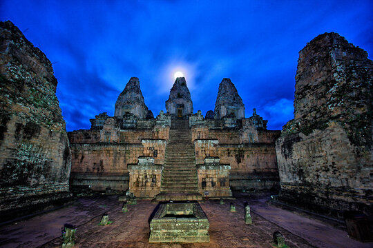 View of Pre Rup temple and rain falling on back