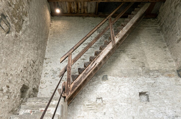 Old stairs in castle, Switzerland. Old stone building with stairs.. Stone architecture.