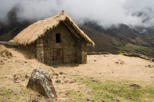 A larger thatch roof stone structure in the traditional village of the Q'eros high in the Peruvian Andes.