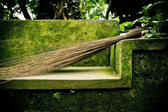 Broom on bench.