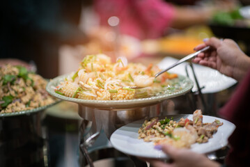 scooping the food, catering, dinner time