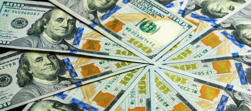 A Close-up Of Many Hundred-dollar Bills Lie In An Even Circle. Heap Of Dollars, Money Background