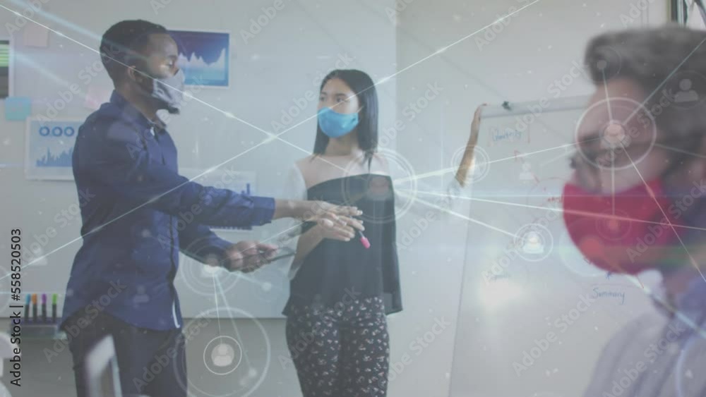 Canvas Prints Animation of network of connections over diverse business people wearing face masks at office