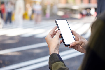 cell phone blank white screen mockup.hand holding texting using mobile on desk at office.background empty space for advertise.work people contact marketing business,technology