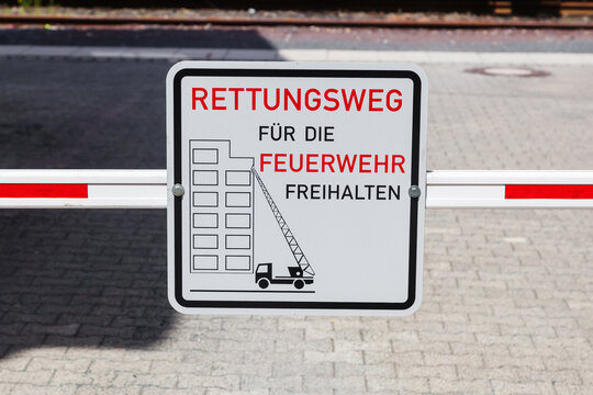 barrier with a German sign, that means keep the escape route clear for the fire department