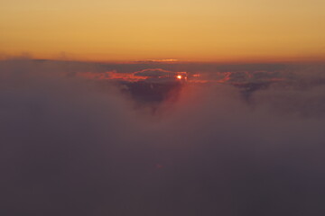 Fototapeta na wymiar Sunset sun seen from the mountains