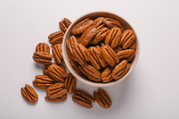 Tasty fresh ripe pecan nuts on white background, flat lay