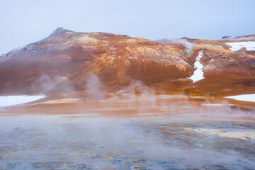 Geothermal Area in Iceland, Pure Green Energy at Sulfur Valley with Smoking Fumaroles. Famous tourist spot Hverir. Real Volcanic Activity near Myvatn lake. Evaporating water. Shot in Hight Resolution