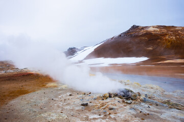 Geothermal Area in Iceland, Pure Green Energy at Sulfur Valley with Smoking Fumaroles. Famous tourist spot Hverir. Real Volcanic Activity near Myvatn lake. Evaporating water. Shot in Hight Resolution