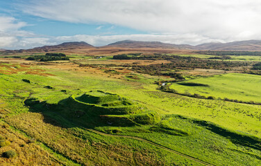 Dun Nosebridge multivalate prehistoric Iron Age fort hillfort above the River Laggan, Islay, Inner Hebrides, Scotland. Aerial. Looking East