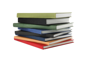 Many different books stacked on white background