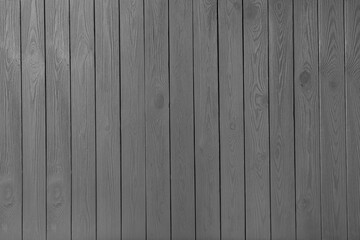 Texture of grey wooden board on black background, top view