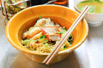 Dried Wonton Noodles with BBQ Pork Traditional Asian cuisine
