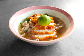 Fried Chicken  Noodles Put the chopped fried chicken into pieces, boiled pork. and lime add flavor to Thai street food 
