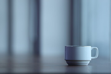 a cup of coffee in the blue of the morning