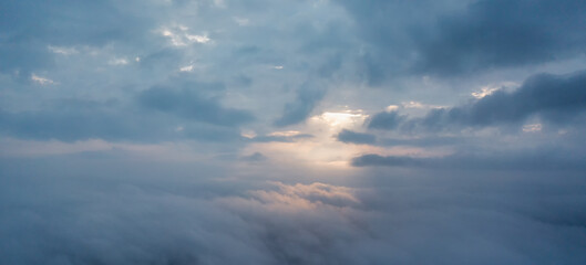 Fototapeta na wymiar A wonderful dawn above the clouds. Natural background