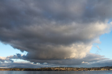 Fototapeta na wymiar line of clouds over a lake near Seattle, WA, USA