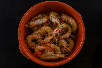 Grilled shrimp, Portuguese style with crushed chili peppers, garlic and parsley at an al fresco restaurant in Porto