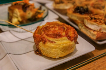 Artisanal pintxos or tapas pastry with cheese in Pamplona, Spain