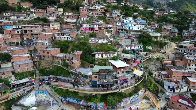Aerial shot drone descends on most touristic part of comuna 13 shanty town