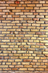 A brick wall, made of treated, antique-styled brick.