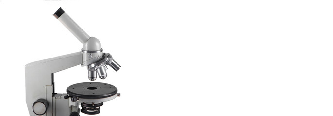 A microscope with three lenses on a white background.