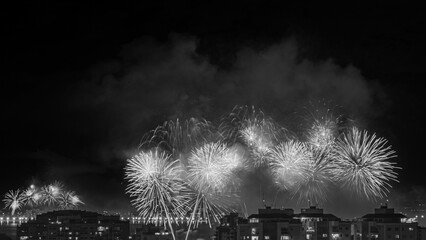 NITERÓI, RIO DE JANEIRO, BRAZIL – 01/01/2023: Night photo of the arrival of the New Year (Réveillon) in black and white with fireworks in the sky of a Brazilian city