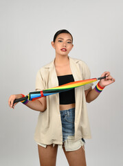 Portrait young asian woman in concept LGBQ with wristband on white background
