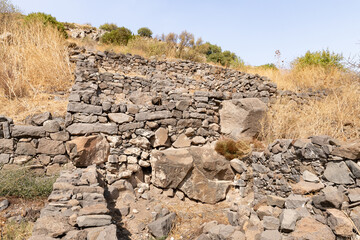 Remains  of buildings and stone walls on the ruins of the Gamla city, Golan Heights, northern Israel