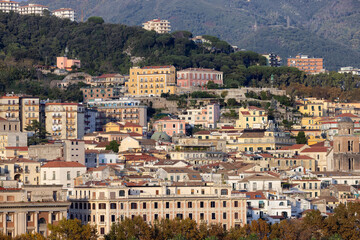 Fototapeta na wymiar Touristic City by the Sea. Salerno, Italy. Aerial View. Cityscape and mountains background