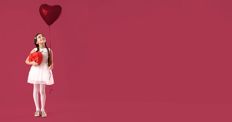 Funny little girl with gift and balloon on color background with space for text. Valentine's Day celebration