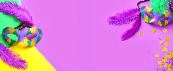 Carnival masks and decor on color background with space for text © Pixel-Shot