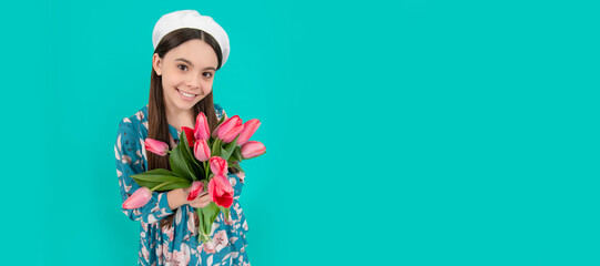 happy child in beret with tulips. mothers or womens day. kid hold flowers for 8 of march. Banner of spring child girl with tulips flowers bouquet, studio portrait with copy space.