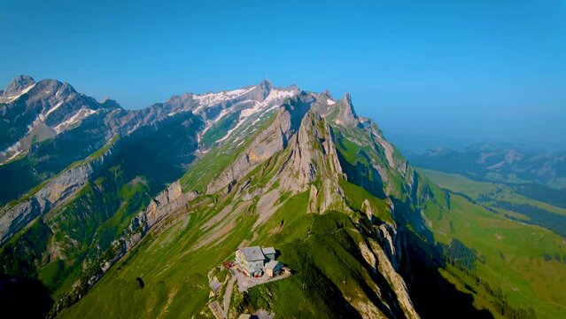 Schaeffler mountain ridge swiss Alpstein, Appenzell Switzerland, a steep ridge of the majestic Schaeffler peak, Switzerland. couple man and woman mid age in the mountains, man and woman hiking