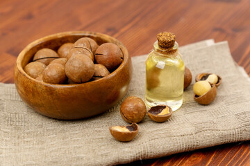 Macadamia Nut Oil and peeled macadamia nut. Healthy Skin and Hair and Natural Healing Oil Treatment.