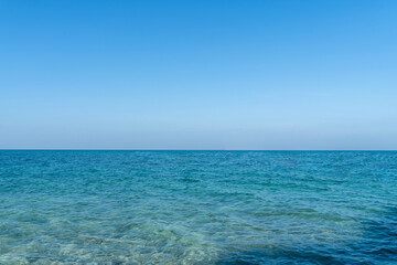 The water sea is clear and bright blue. wide sea view, landscape blue ocean waves.	
