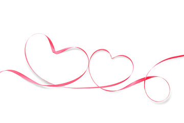 Hearts made of pink ribbon on white background. Valentine's Day celebration