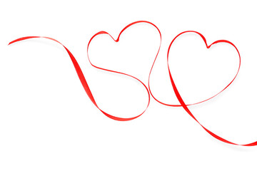 Hearts made of red ribbon on white background. Valentine's Day celebration