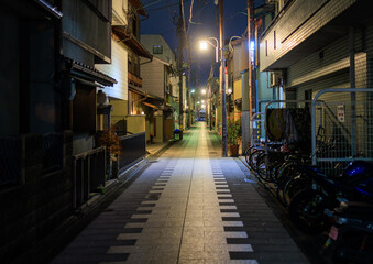 Quiet street in residential Kyoto neighborhood at night - 558580150