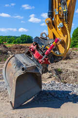 Excavator bucket at a road construction site