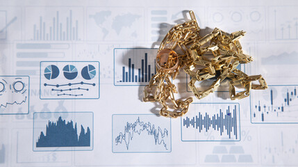 Golden jewelry on financial graphs.