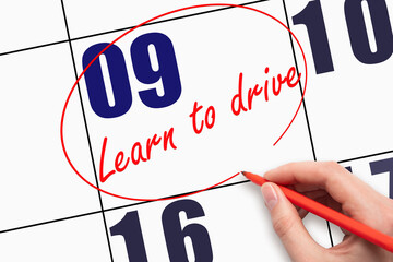 9th day of the month. Hand writing text LEARN TO DRIVE on calendar date and circling it.