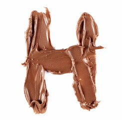 Cream chocolate spreading in shape letter H, alphabet isolated on white, clipping path, top view