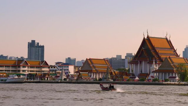 Bangkok, Thailand. December 29, 2022. Wat Kalayanamit Woramahawihan, Zoom out of  riverside temple in Bangkok.