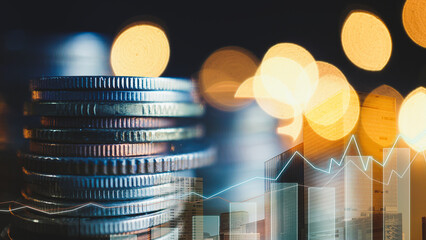 Double exposure of graph, tall building and rows of coins for finance and business concept       - 558593335